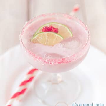 Fresh pomegranate cocktail with garnish of lime and pomegranate