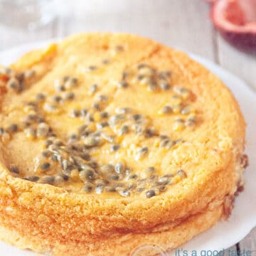 a cheesecake topped with passion fruit (and some passion fruit in the corner)