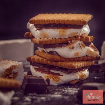 A square photo with homemade 's mores stacked on top of each other.