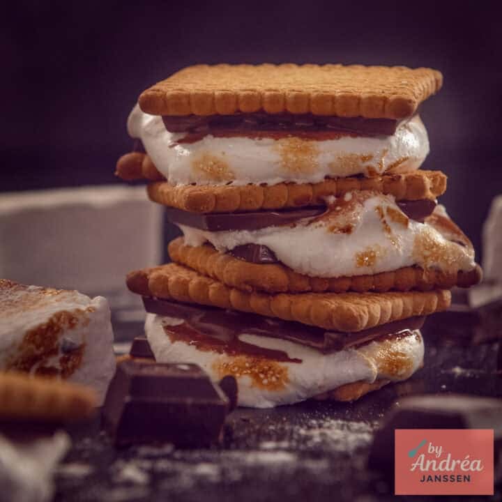 A square photo with homemade 's mores stacked on top of each other.