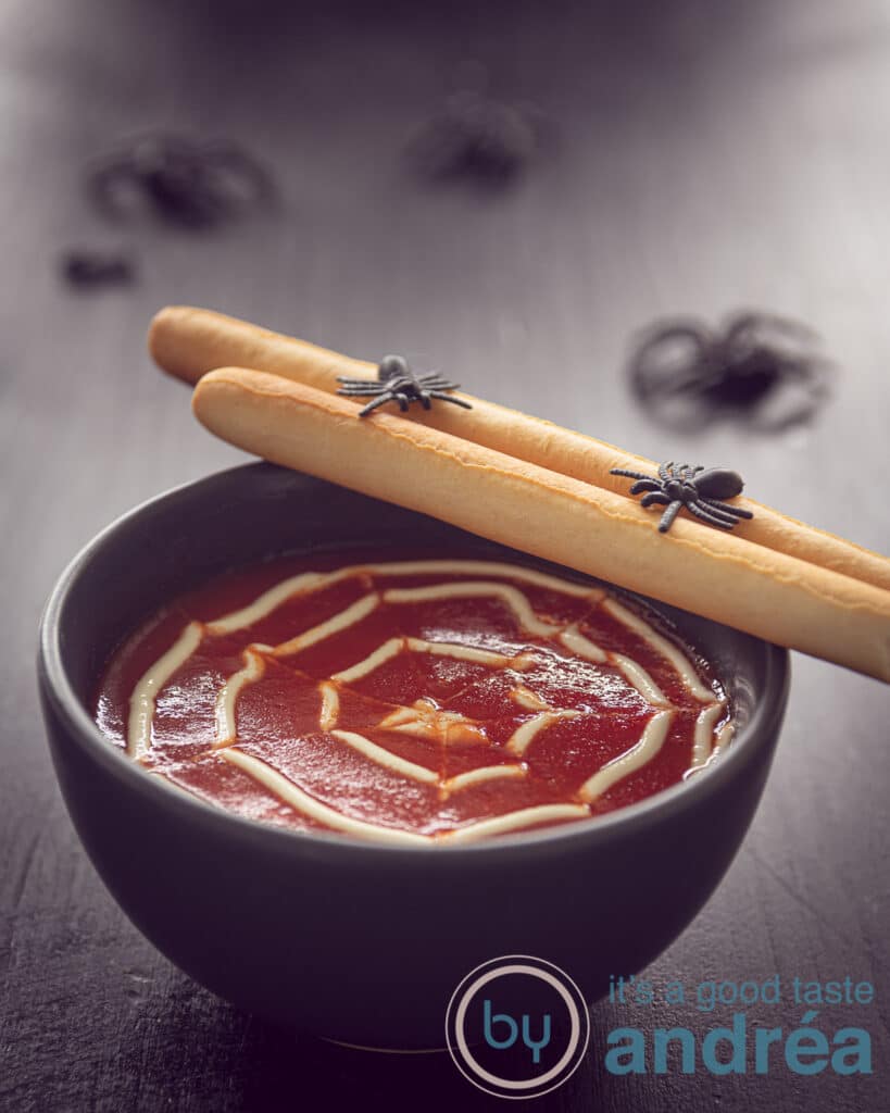 Creamy tomato soup with meatballs for Halloween