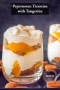 Two glasses diagonally behind each other with tiramisu with pepernoten and mandarin. A text: Pepernoten Tiramisu with Tangerine