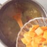 Pumpkin is added to the vegetable broth.