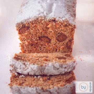 A square photo with a carrot cake filled with gingerbread nuts.