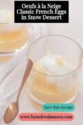 Two glasses of vanilla sauce and snow eggs. A text at the top reads: Oeufs a la neige - classic French in snow dessert