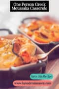 Two ramekins filled with moussaka on a wooden board. A text reads: One Person Greek Moussaka Casserole