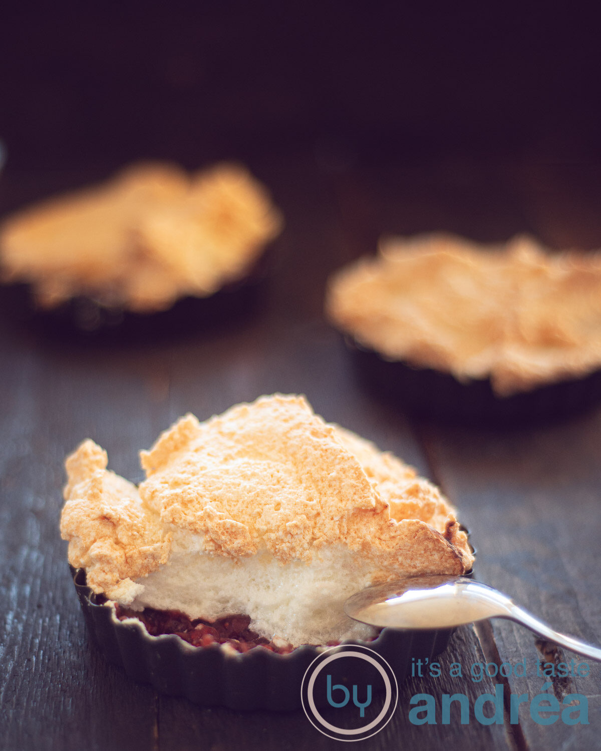 three quiche forms filled with sweet rhubarb stew and topped with a caramelized foam.