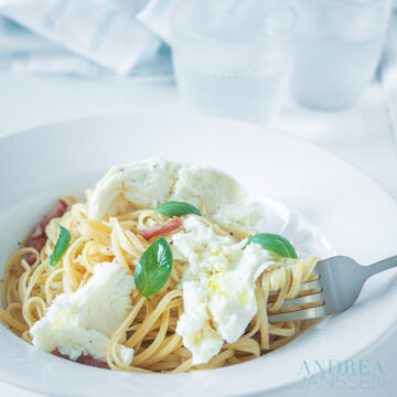a plate with miso spaghetti with mozzarella and bacon