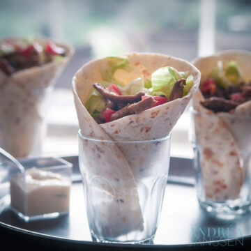 3 glasses filled with shawarma wraps