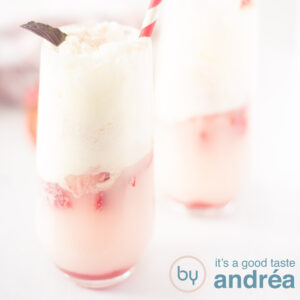 A square photo with two glasses of soda ice cream with strawberries on a white background