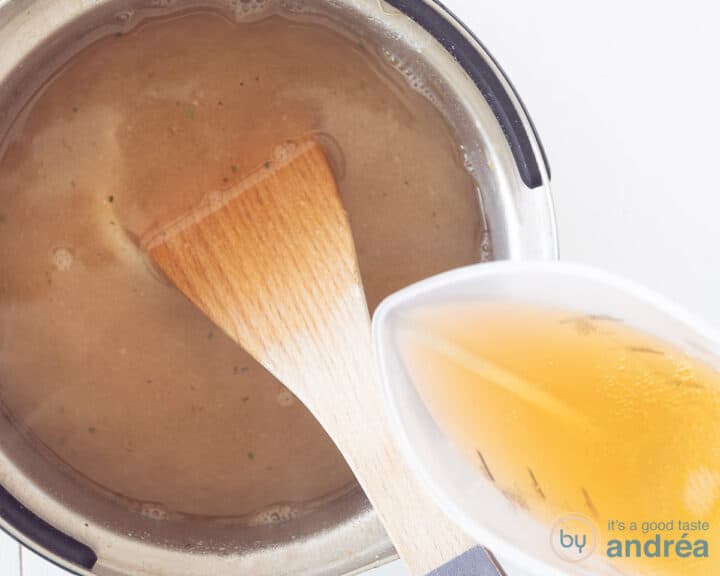 Broth is poured into the pan