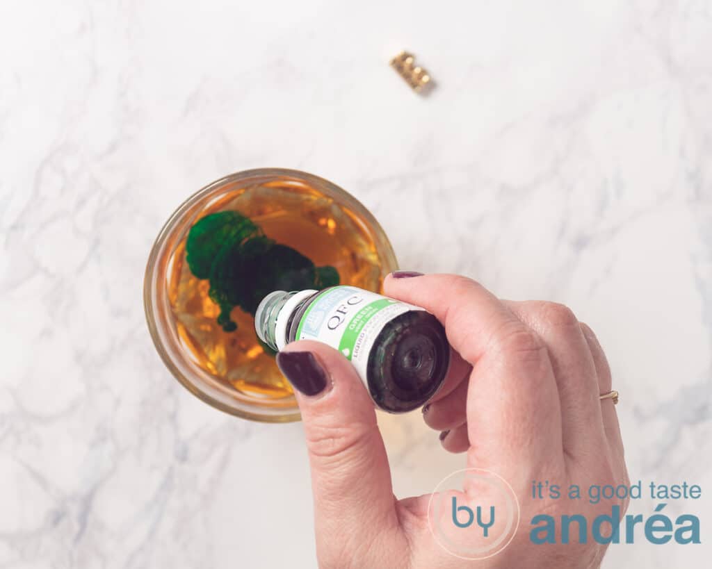 add green food coloring to the apple juice