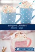 Two blue star-print mugs of Baileys hot chocolate topped with whipped cream and cocoa powder, served with striped paper straws