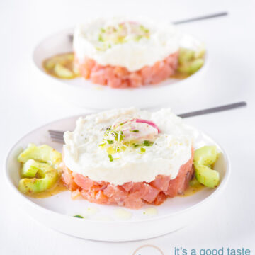 two plates with towers of smoked salmon and goat cheese