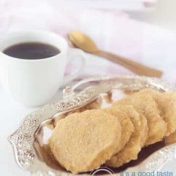 Ginger cookies on plate with cup of coffee