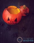 Pumpkin soup served in a pumpkin which got a Jack-O-lantern face. With additional spiders