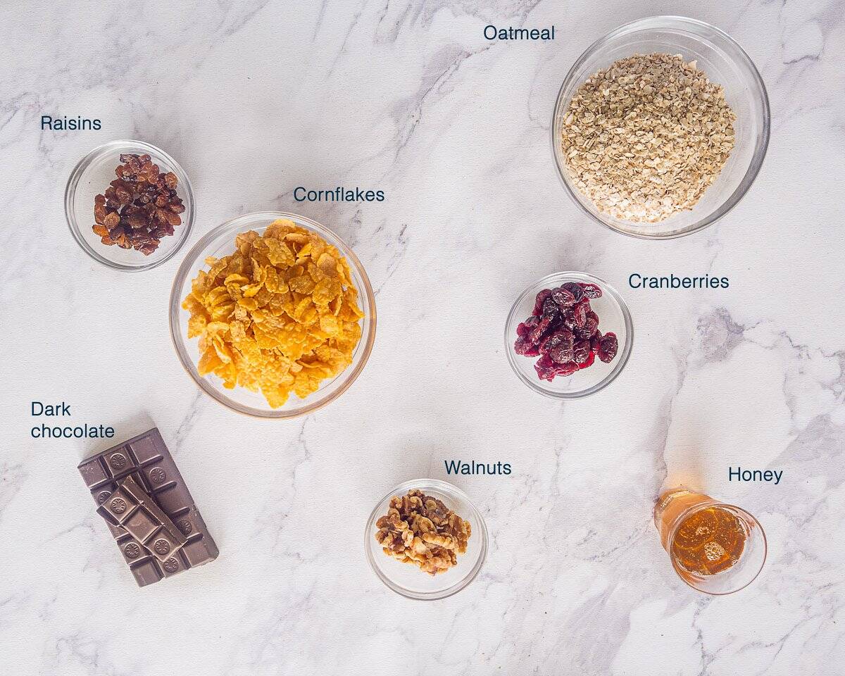 Ingredients Chocolate Granola Bars on a white marbled background with text description