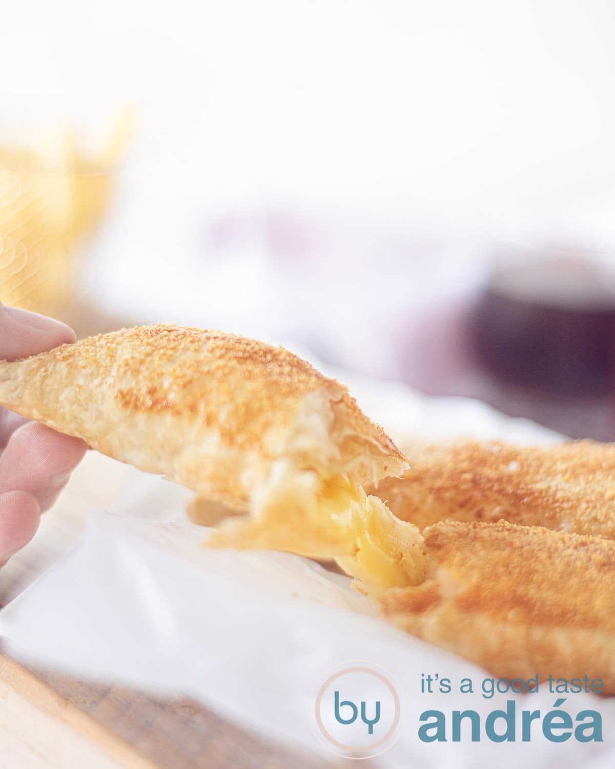 A cheese souffle cut in the middle, the cheese is melted and sticky