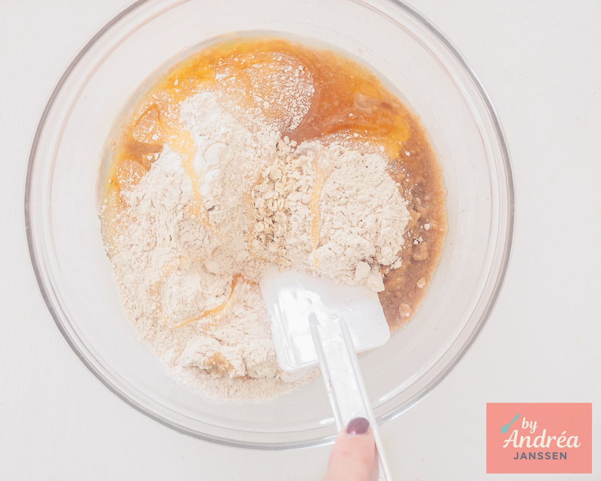 A bowl with, among other things, honey, whole wheat flour and oatmeal.