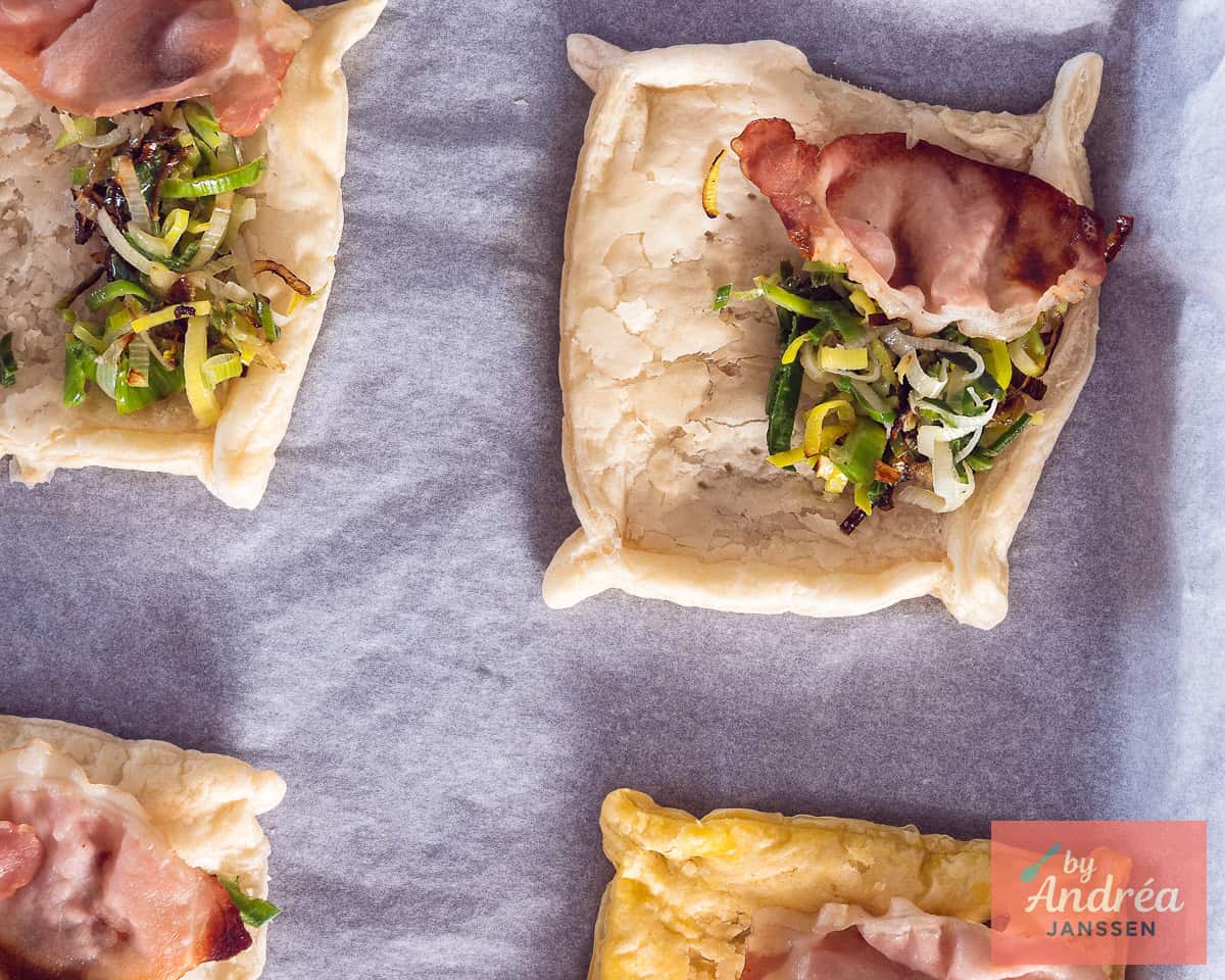 A half-baked puff pastry case filled with leek and bacon