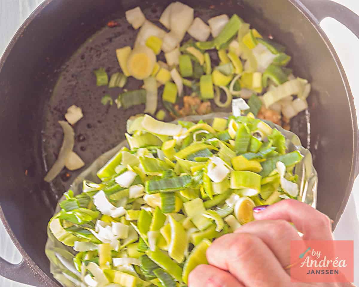 Add sliced leeks to the pan with onion and garlic