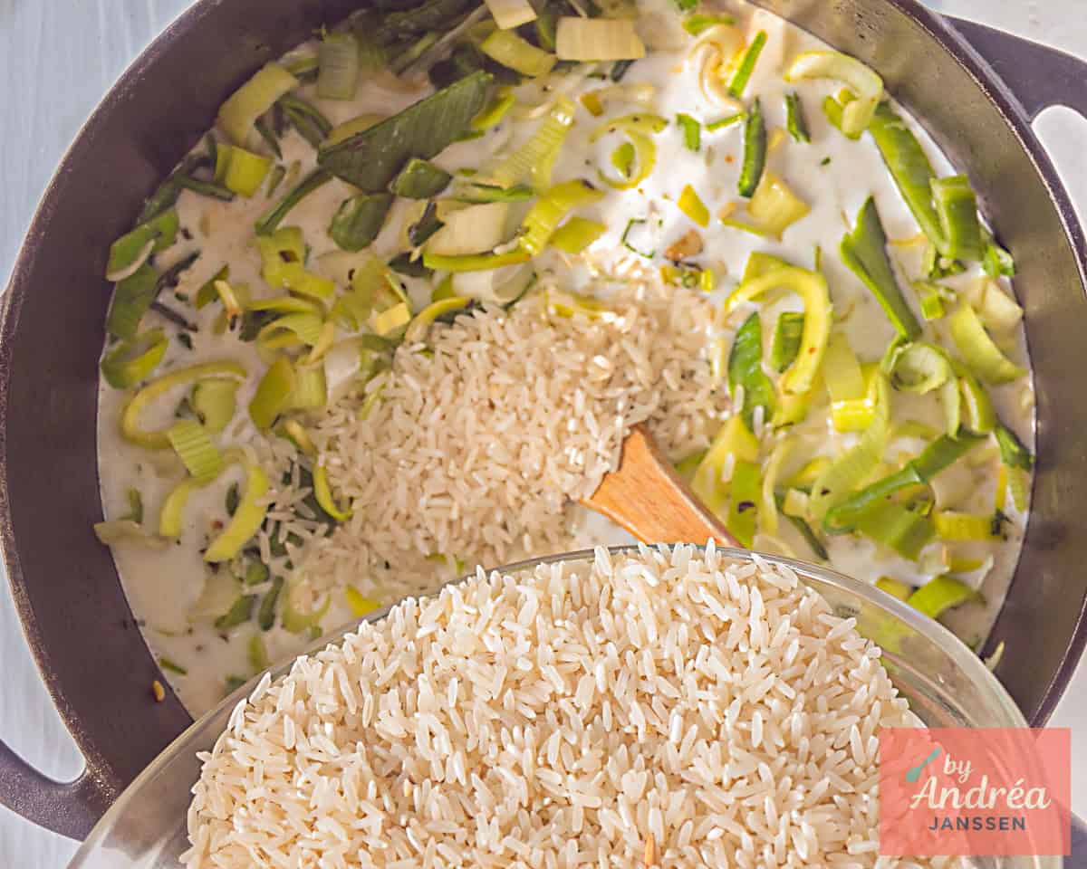 Add rice to the pan with leeks and coconut milk