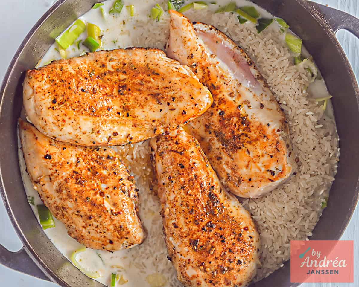 Put chicken on top of the rice in the pan.