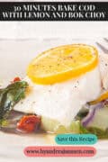 A portion of a cod fillet on a bed of bok choy, sun-dried tomatoes, and lemon. A caption at the top reads: 30 minute Baked Cod with Lemon and Bok Choy.