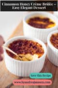 A few ramekins with cinnamon honey creme brulee on a wooden board. A text: cinnamon honey crème brûlée - easy elegant dessert