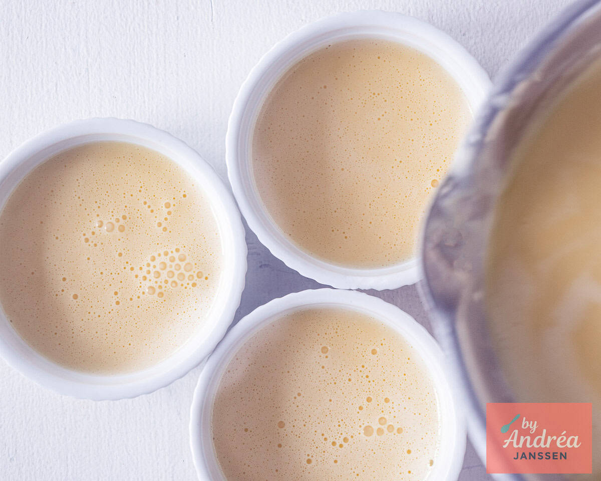 Cream is being poured into the ramekins