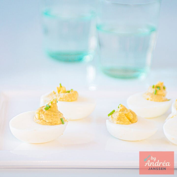 a square photo of a plate with deviled eggs without mayonnaise