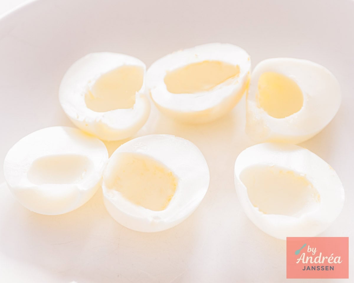 Halved hard-boiled eggs, center scooped out