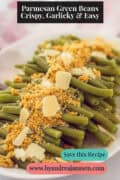 A white bowl with a layer of green beans, Parmesan cheese, and seasoned breadcrumbs. A caption at the top reads: Parmesan Green Beans – Crispy, Garlicky & Easy.