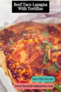 A portion of a white baking dish with a tortilla lasagna, ground meat, and vegetables topped with cheese. Text: Beef Taco Lasagna With Tortillas