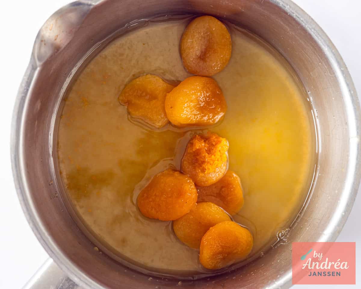 Dried apricots with orange in a saucepan