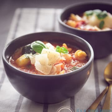 two cups of Filled minestrone soup with pasta