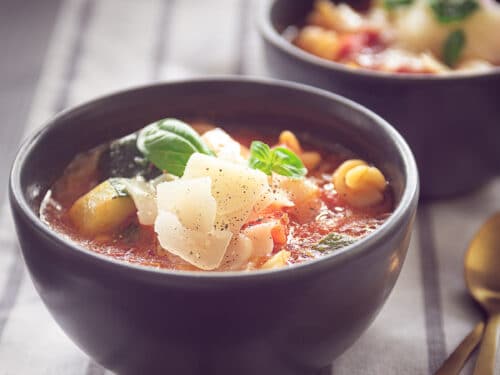 two cups of Filled minestrone soup with pasta