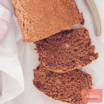 A square photo from above of a gingerbread with currants and walnuts