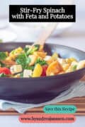 A portion of a stir-fry with potatoes, spinach, feta, and tomatoes, stir-fried. A caption reads: Stir-Fry Spinach with Feta and Potatoes