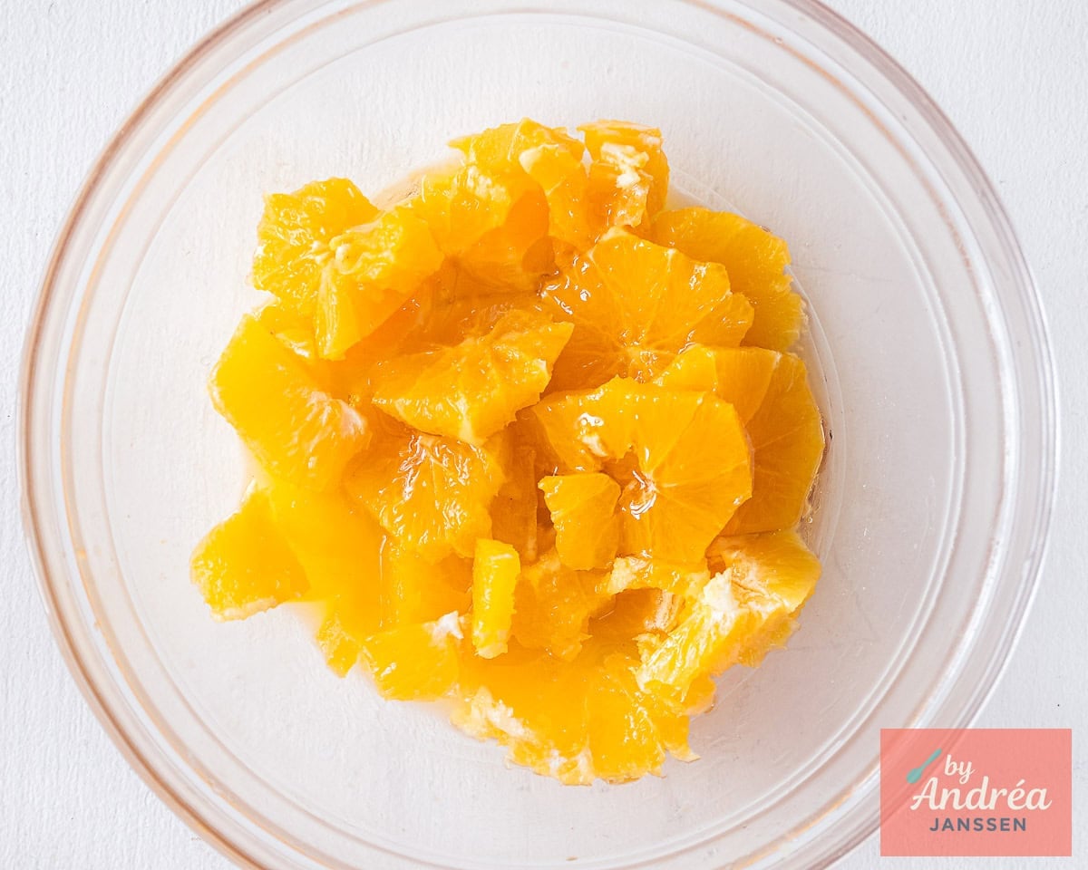 A glass bowl filled with orange slices