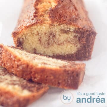 A square photo of part of a marble cake with two slices cut off.