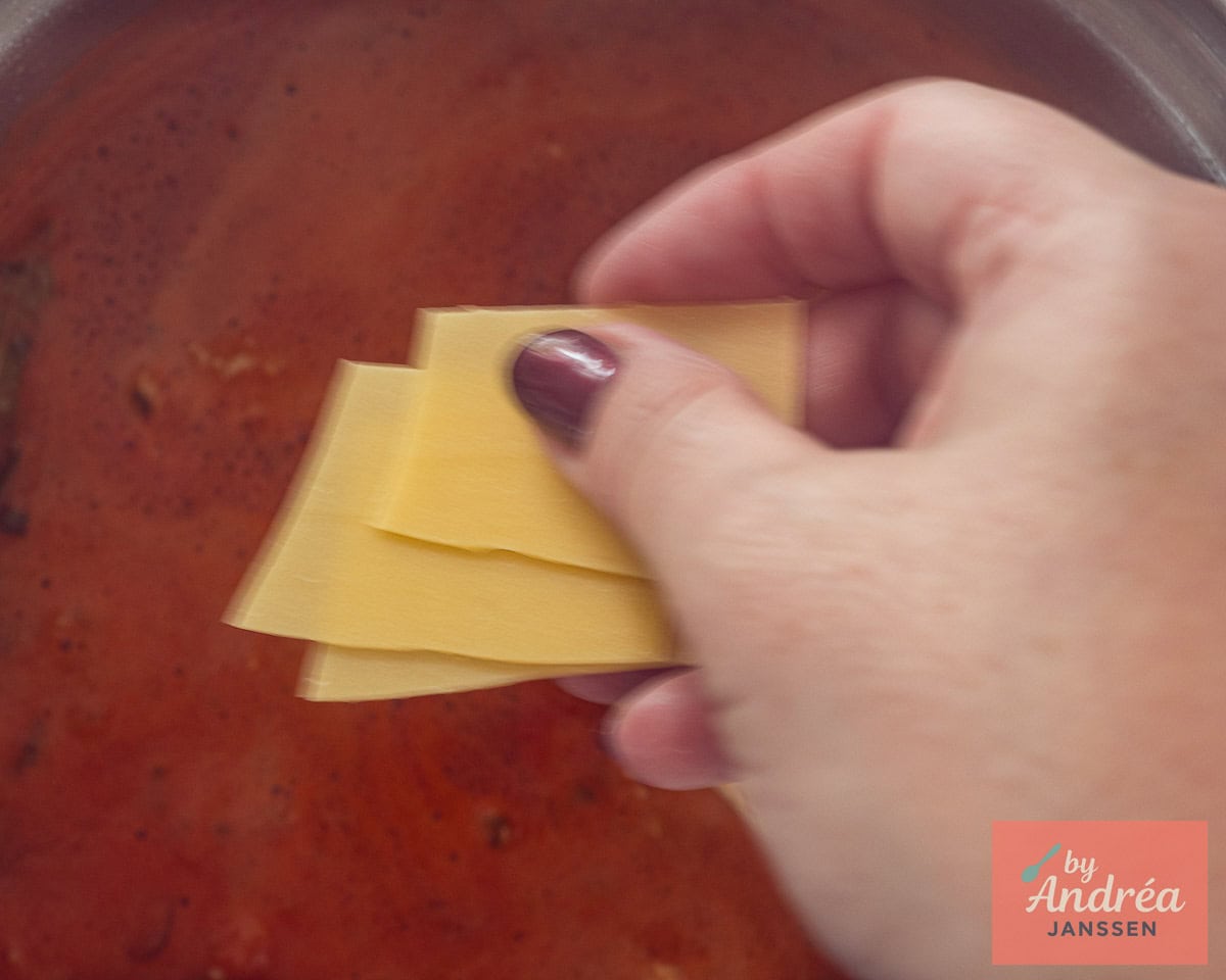 Put in broken lasagne sheets.