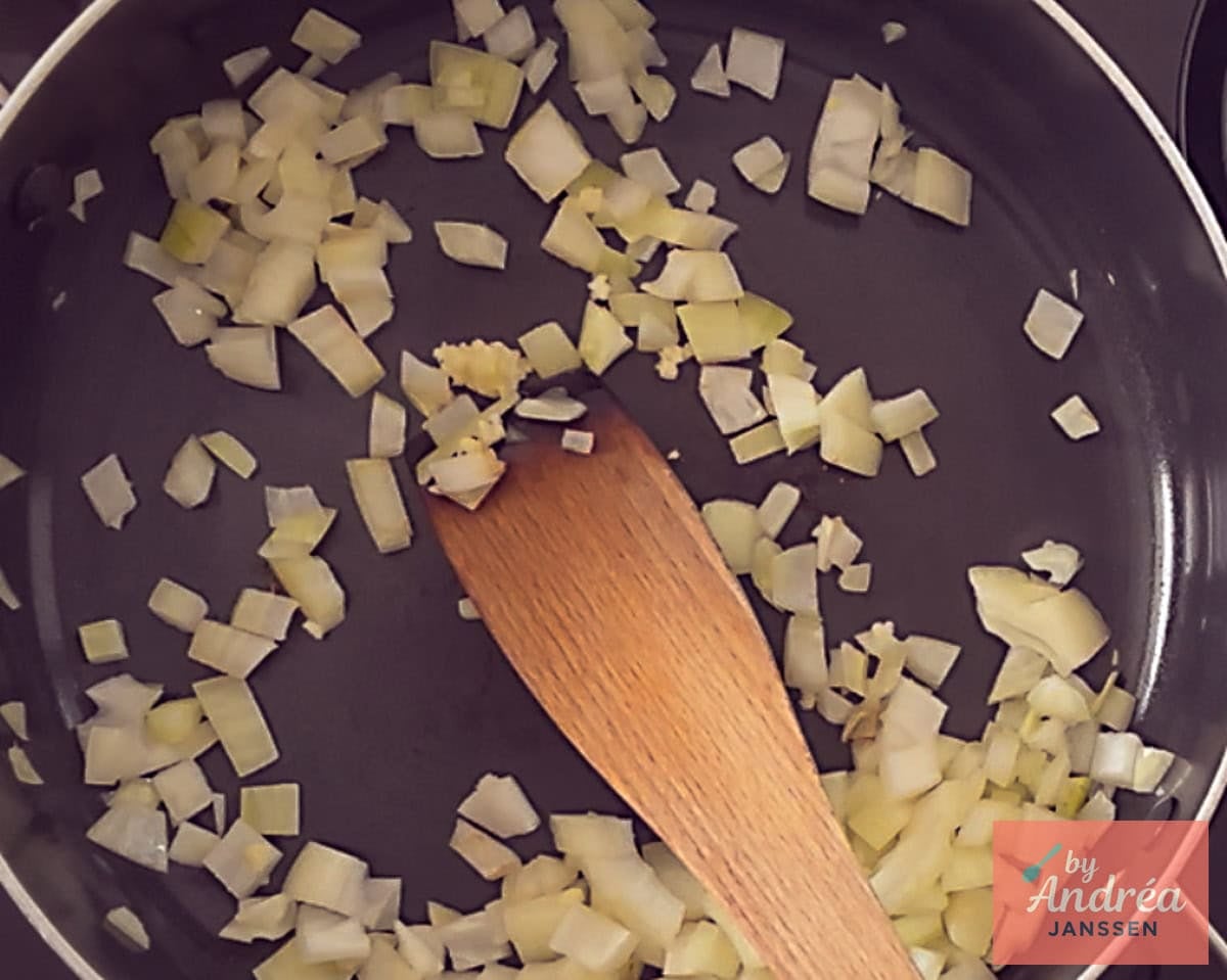 Fry onion and garlic in a skillet