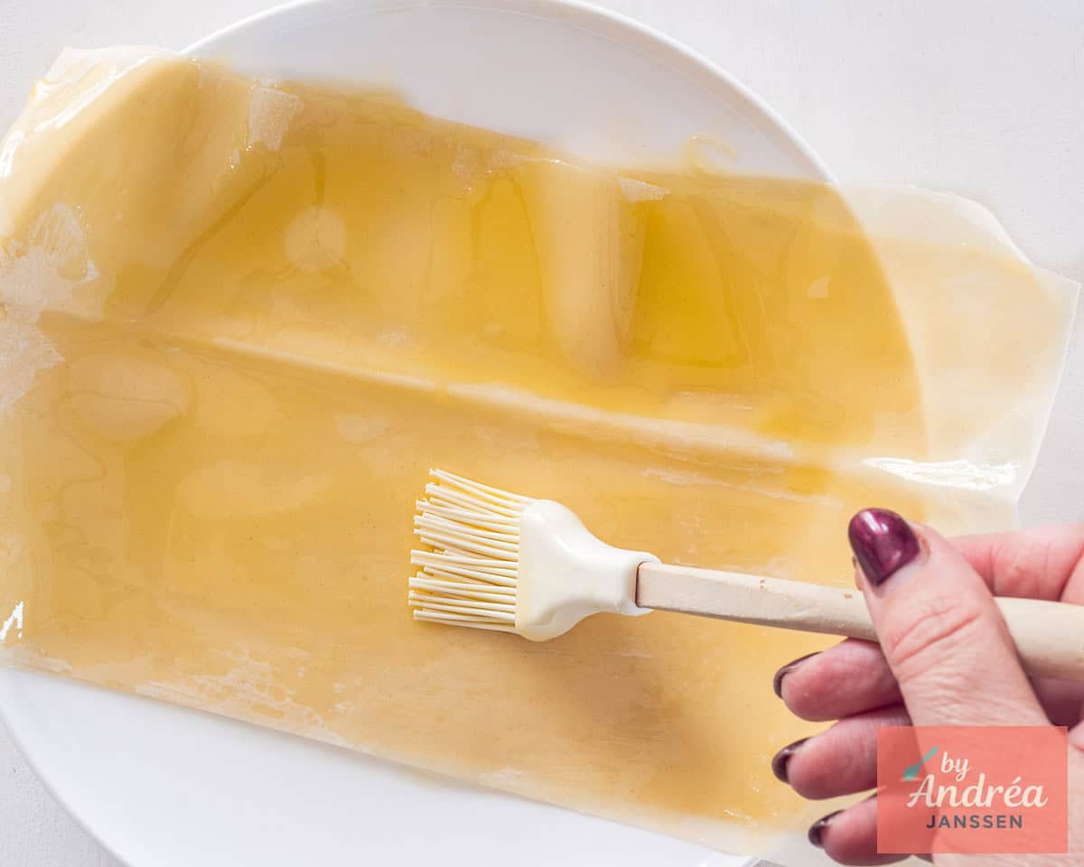 A phyllo dough on a plate brushed with oil