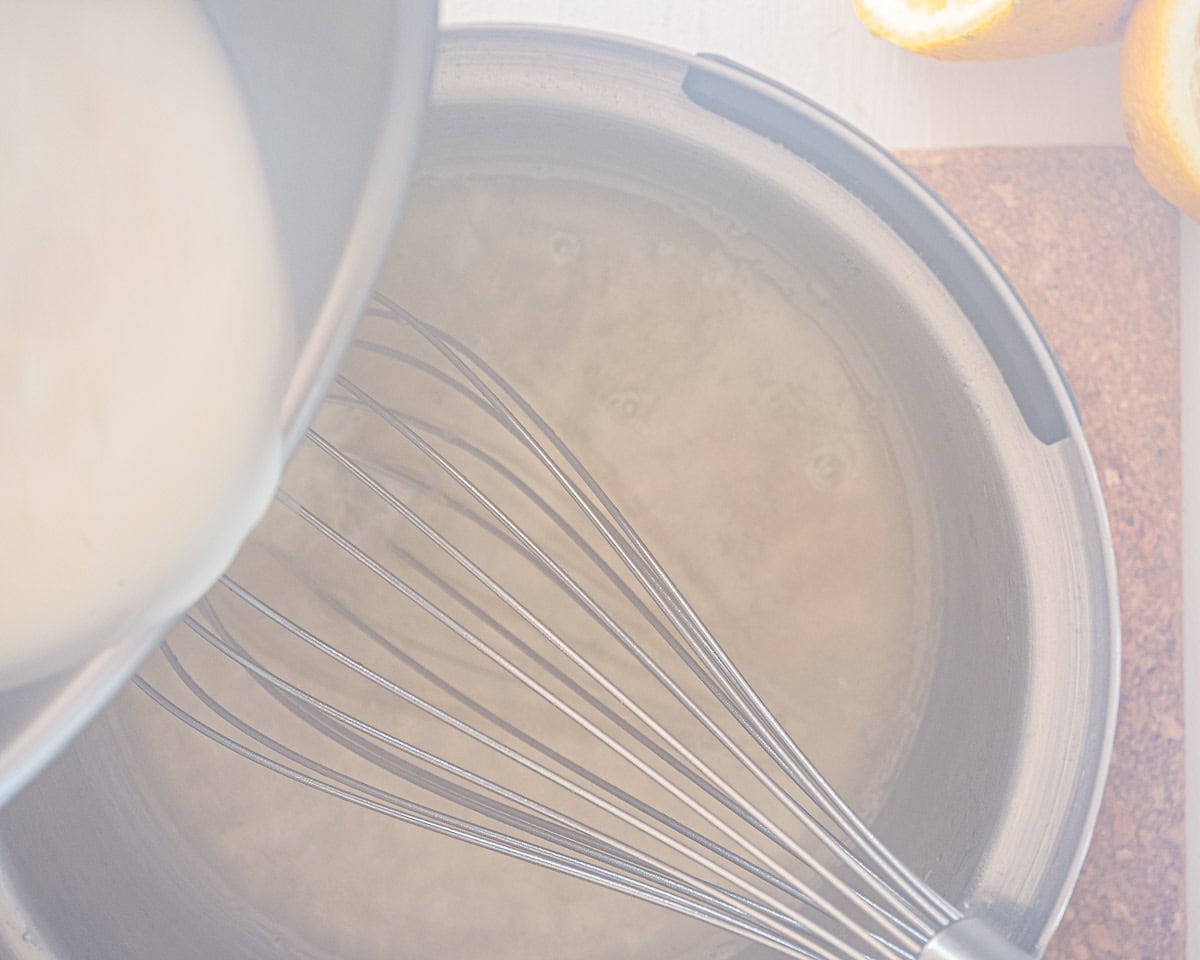 While stirring, add cream to the lemon mix in the saucepan.