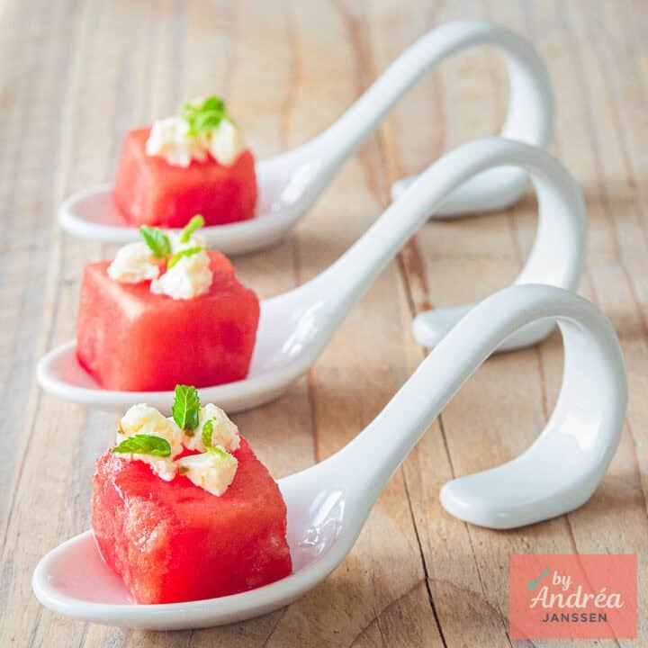 A square picture with three amuse-bouche watermelon with feta and mint