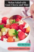 Part of a bowl with three types of melon, goat cheese, honey, and mint. A text at the top reads: Melon Salad with Goat Cheese and Mint