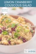 A bowl of couscous salad with cranberries, pine nuts and lemon, text at the top: easy recipe, Lemon Cranberry Couscous Salad