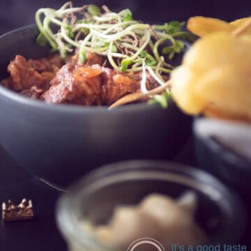 three bowls with flemish stew, fries and mayonaise