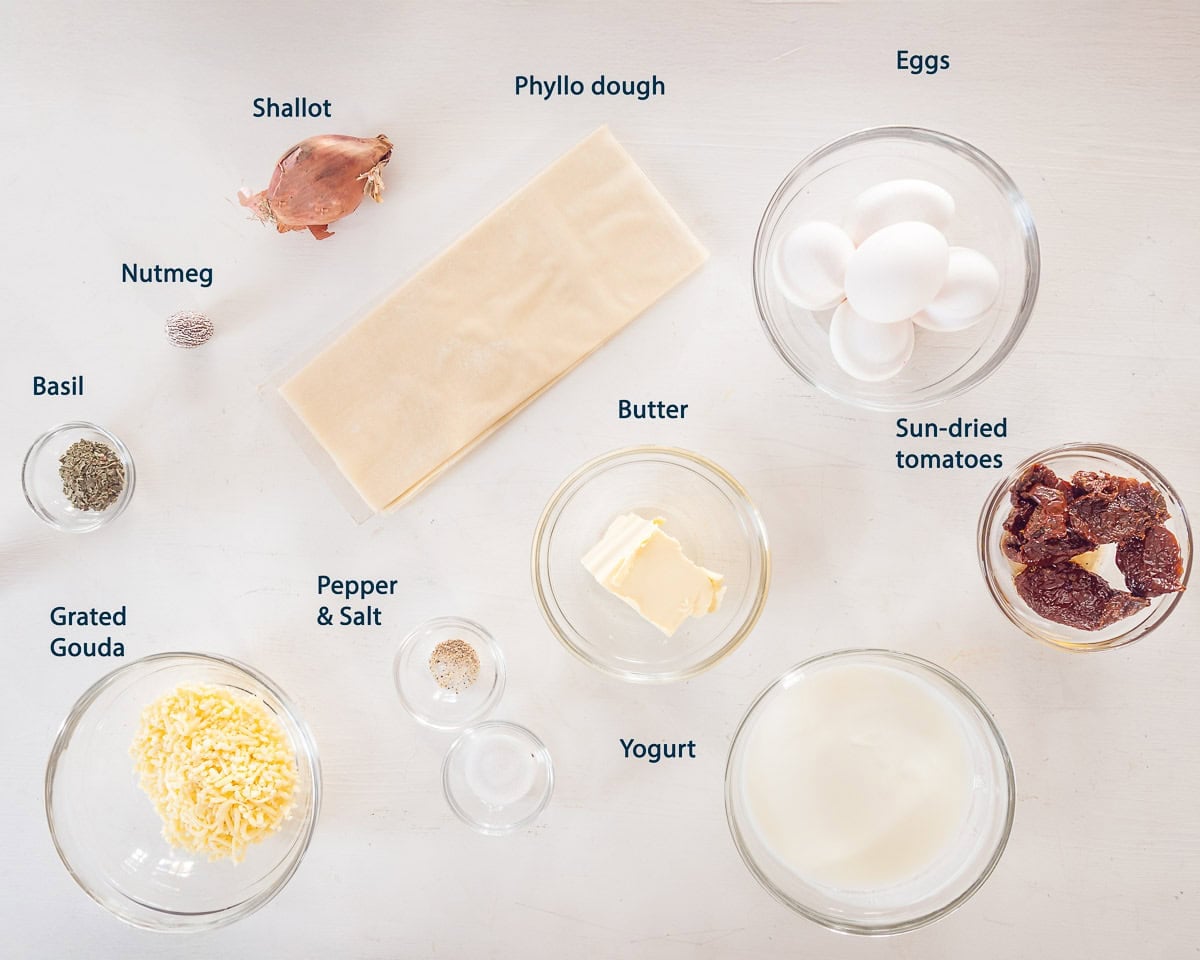 Ingredients Vegetarian Mini Quiche Lorraine with Phyllo Dough on a white background with text description